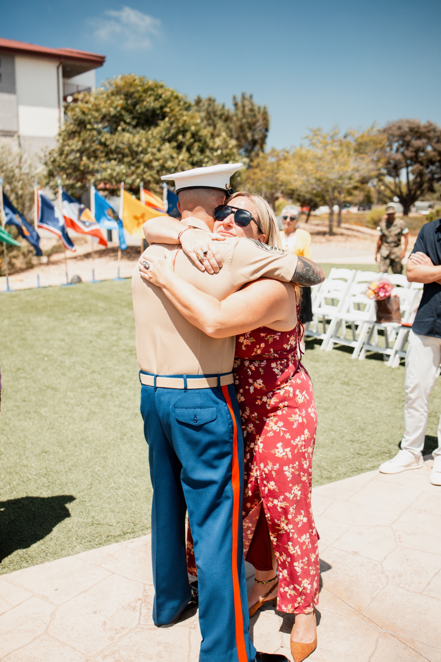 Guests sharing an embrace at Kelly's retirement gathering