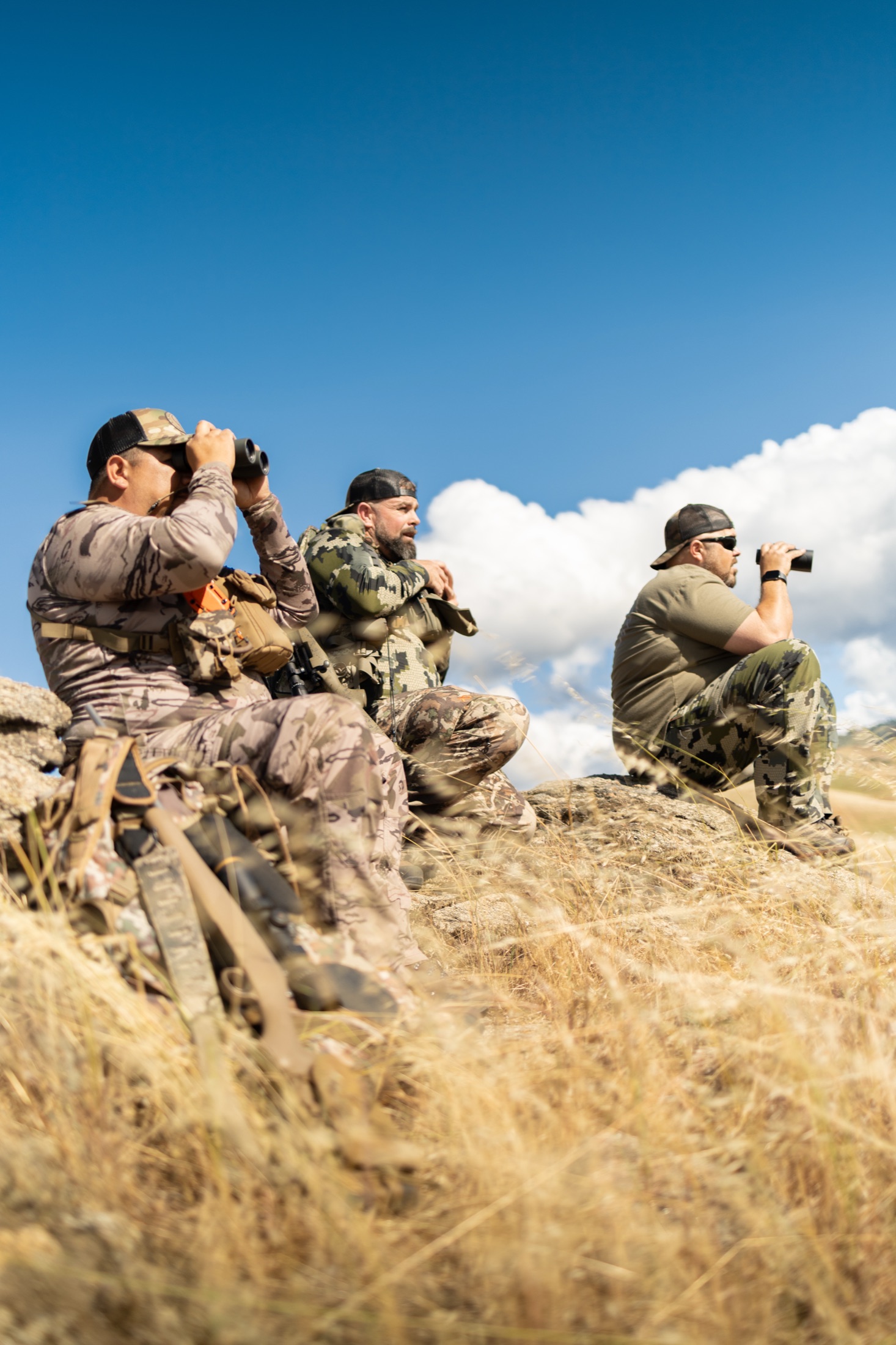 Field team scanning the Tejon landscape with binoculars